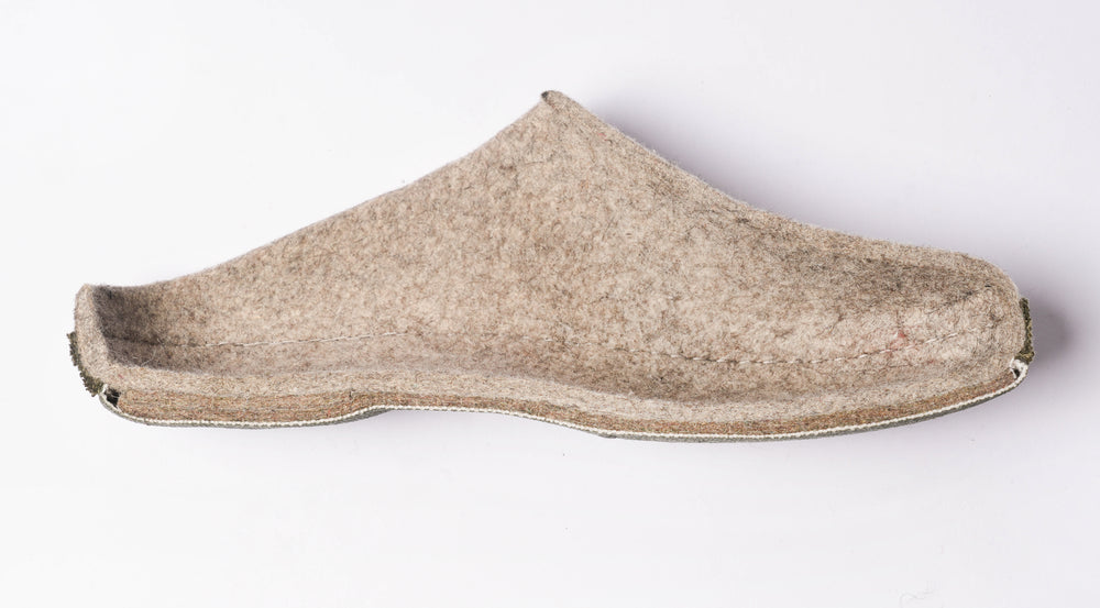 Side profile of a Bishkek Kicks wool felt shoe showing layered construction